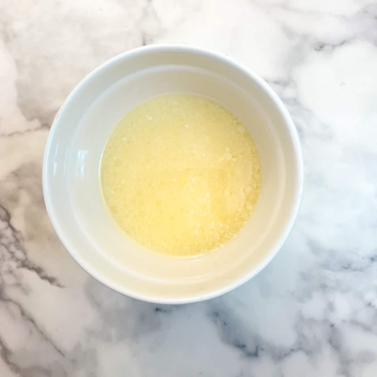 Step 4, combine oil, melted butter, eggs, milk and peppermint essence in a small bowl.