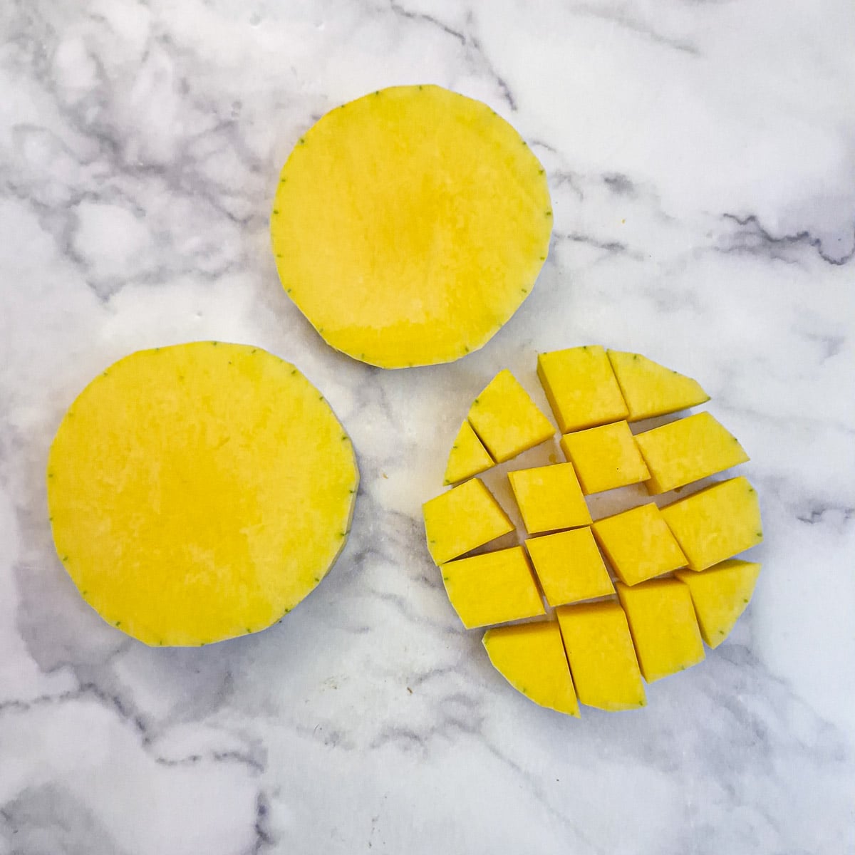 Sliced buttrnut cut into cubes.