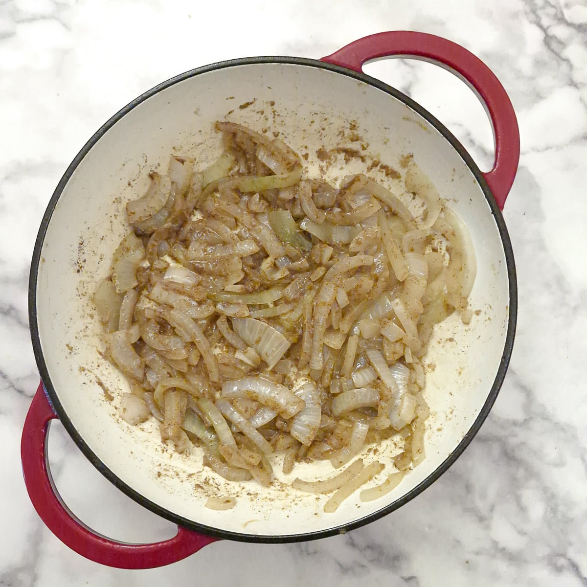 Step 4, spices stirred into the onions to form the base for the bredie.