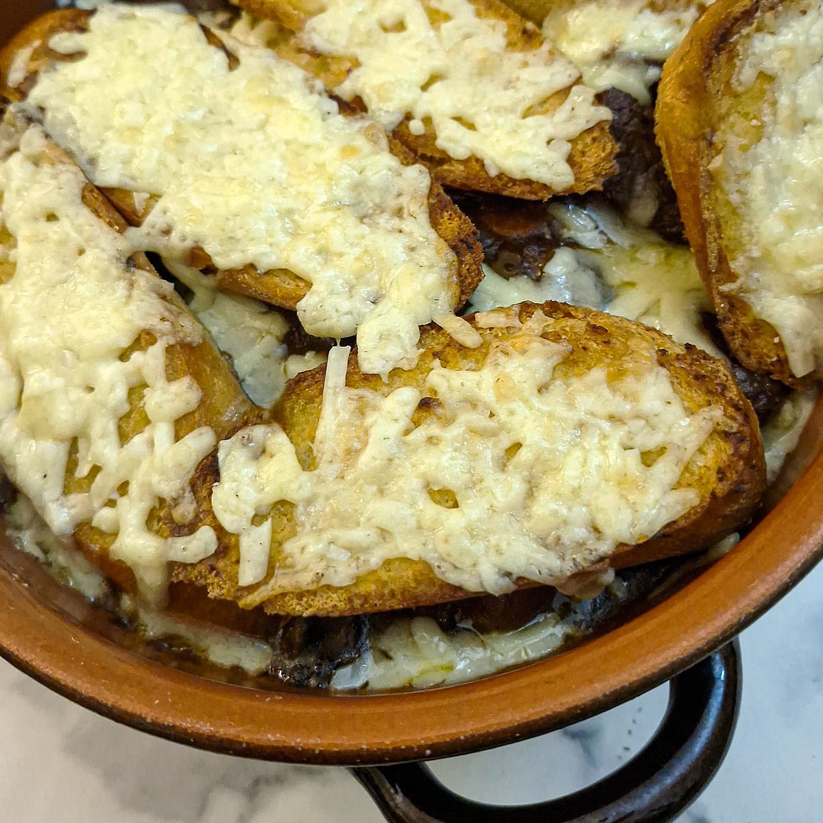 Close up of the cheesy bread topping.
