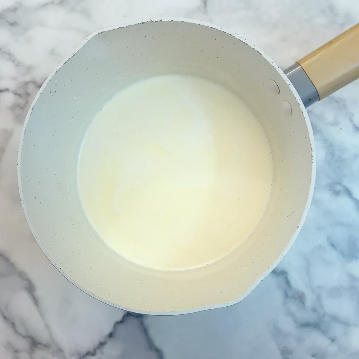 Step 5, milk and cream heating in a small saucepan.