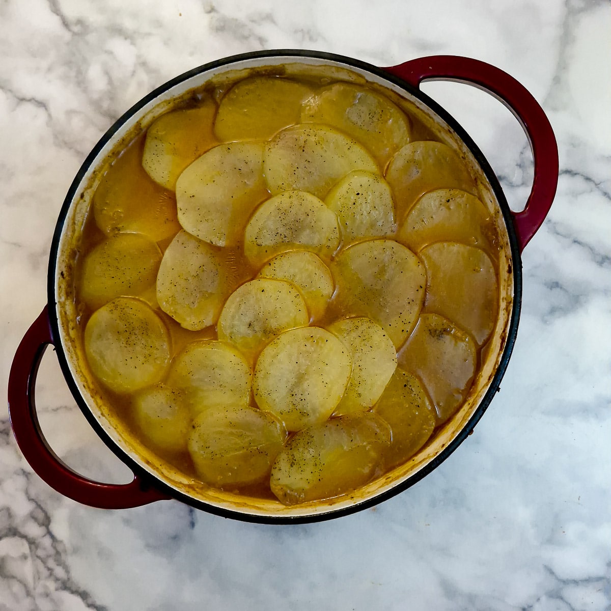 Step 10, the hotpot with softenned potatoes after being in the oven.