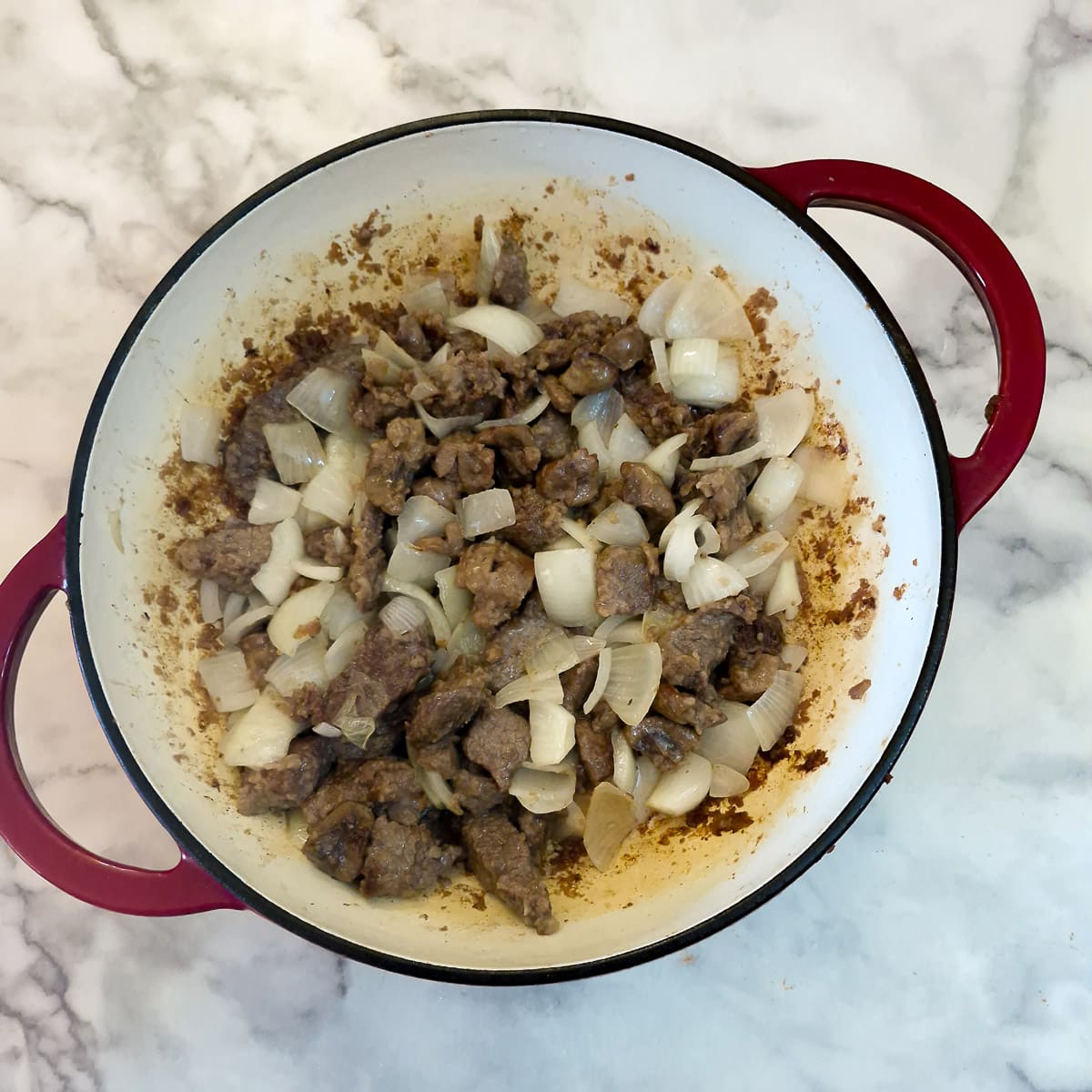 Step 3, onions softening with the meat.