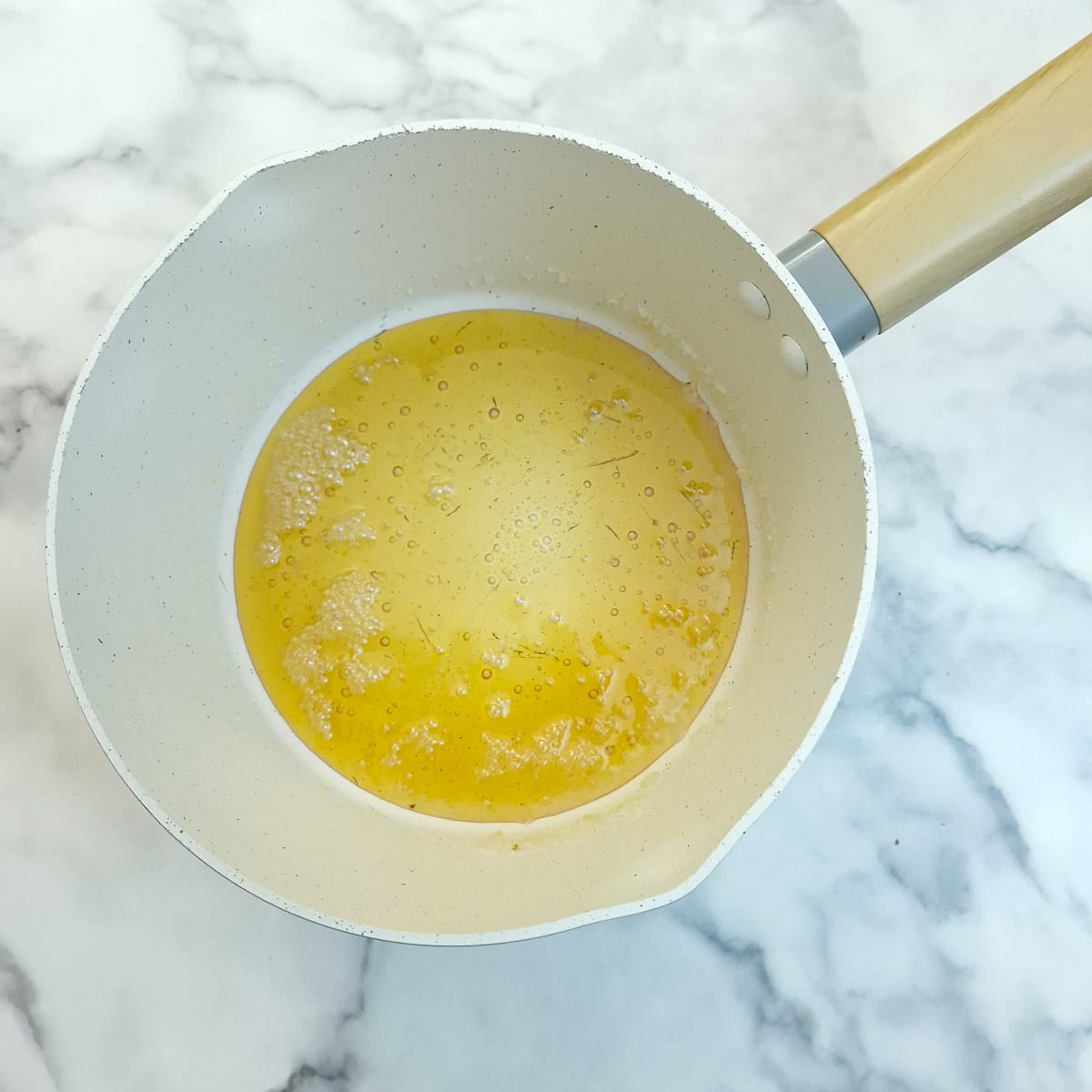 Sugar and water heated in a saucepan until the colour changes to golden amber.