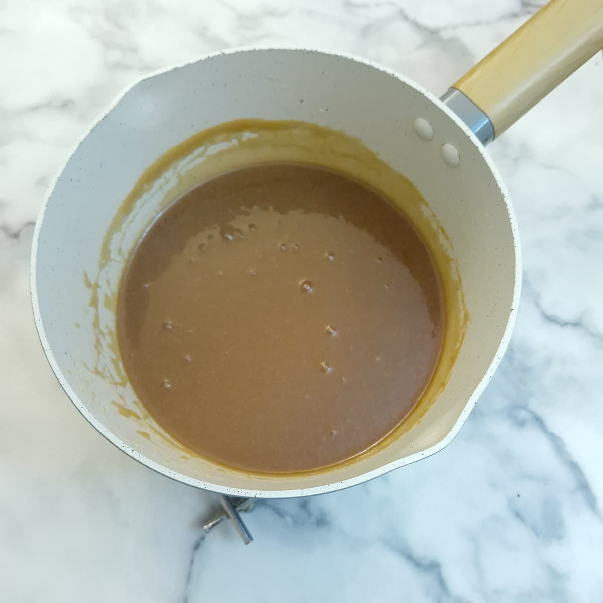 The fully cooked caramel sauce after the Baileys has been stirred in.