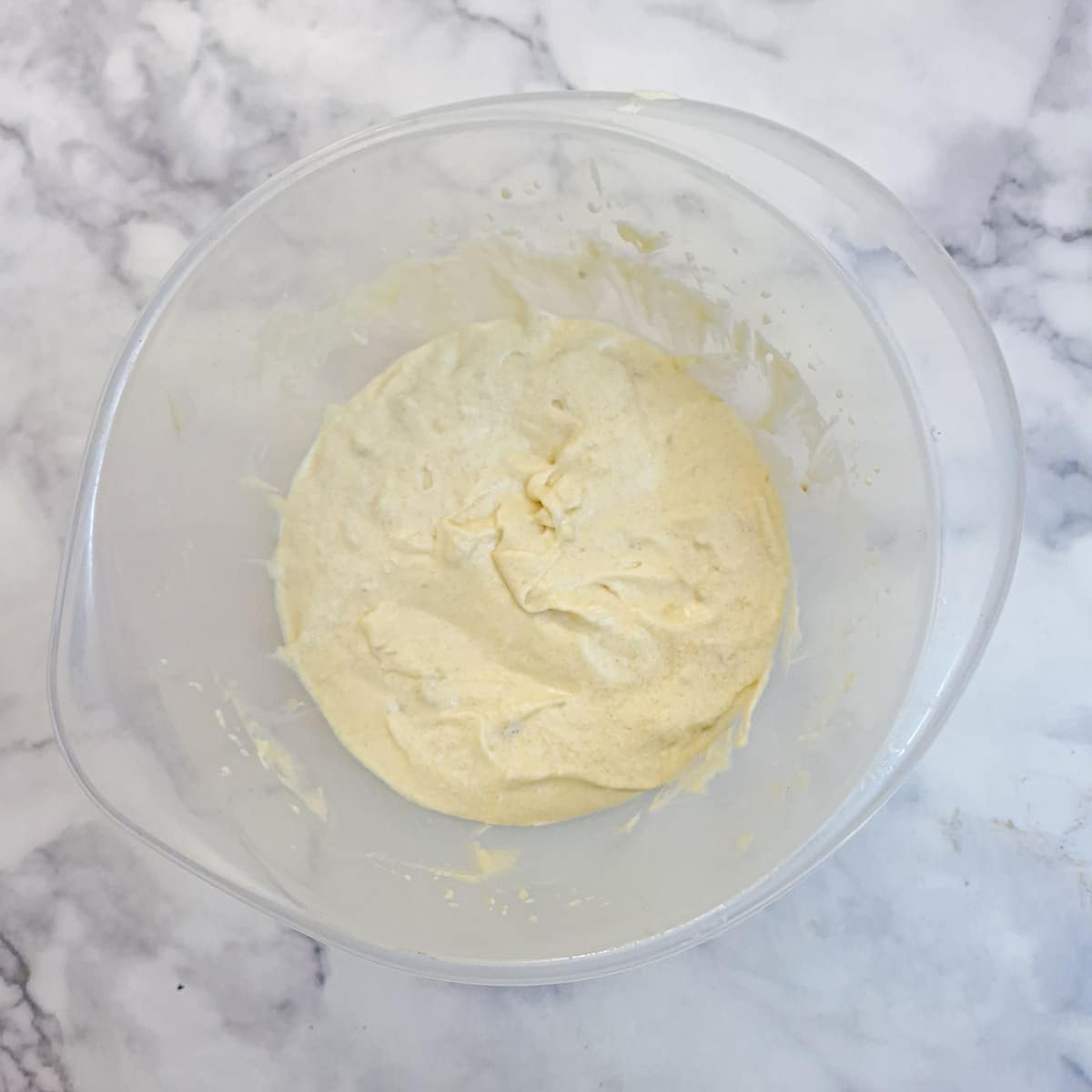 Melted butter, Baileys and mashed bananas stirred into the egg and sugar mixture.