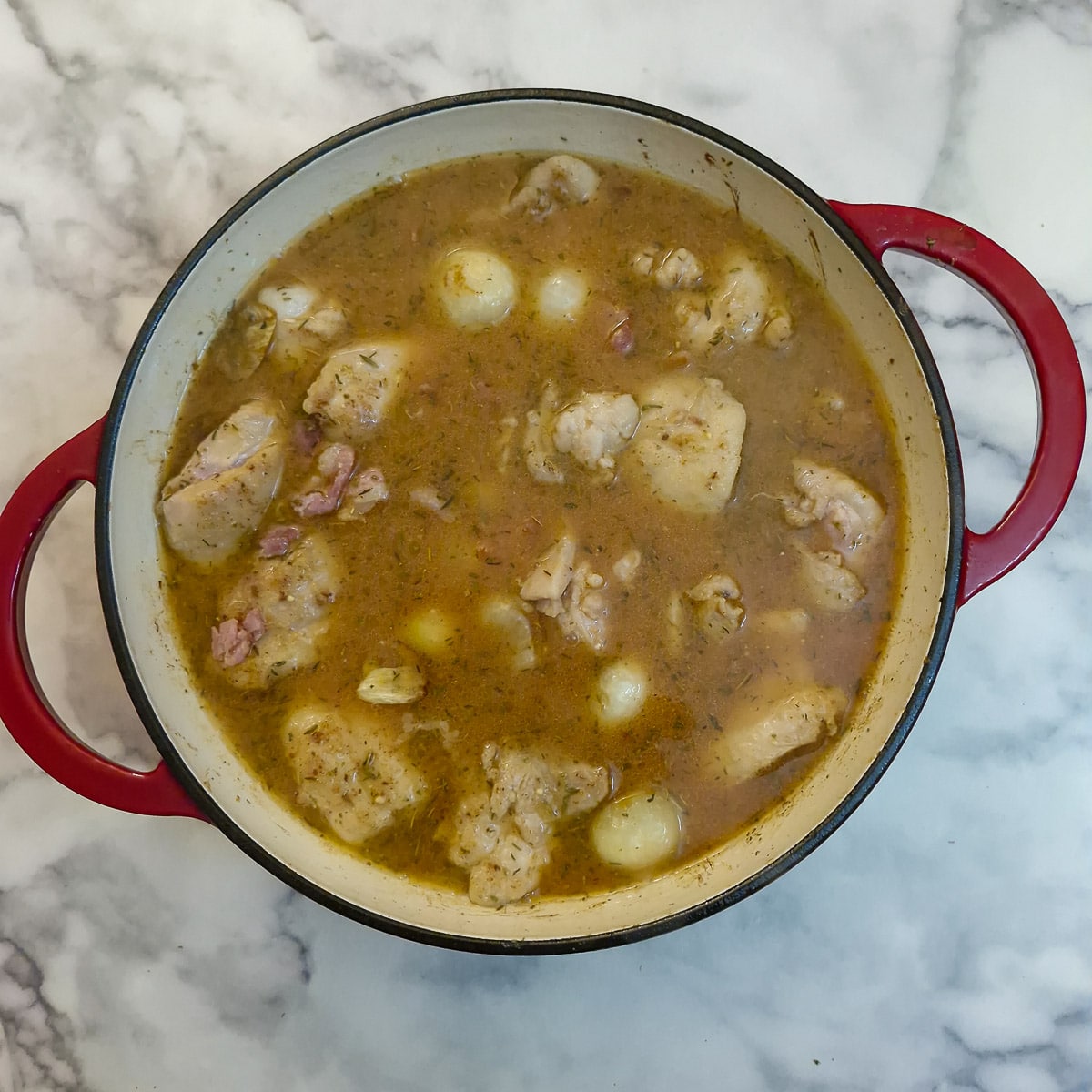 Browned chicken, onions and bacon added to the casserole.