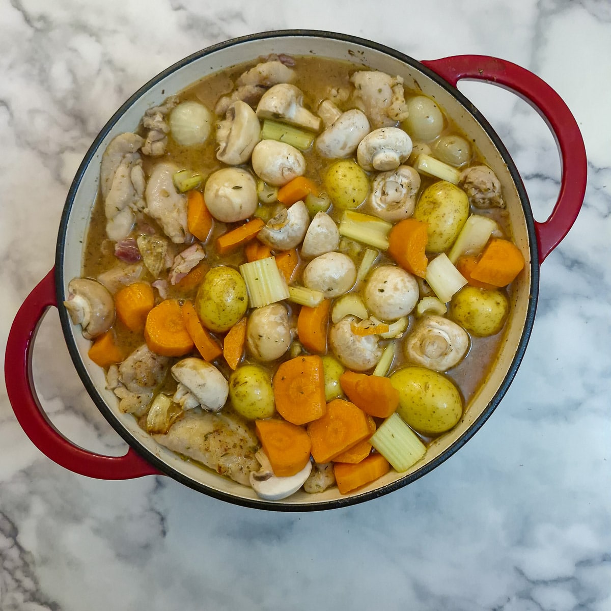 Potatoes, mushrooms, celery and carrots addd to the casserole.