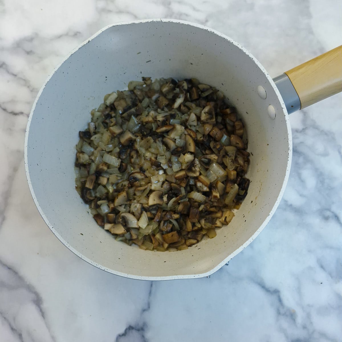 Step 2 - chopped mushrooms added to the onions and being allowed to soften.