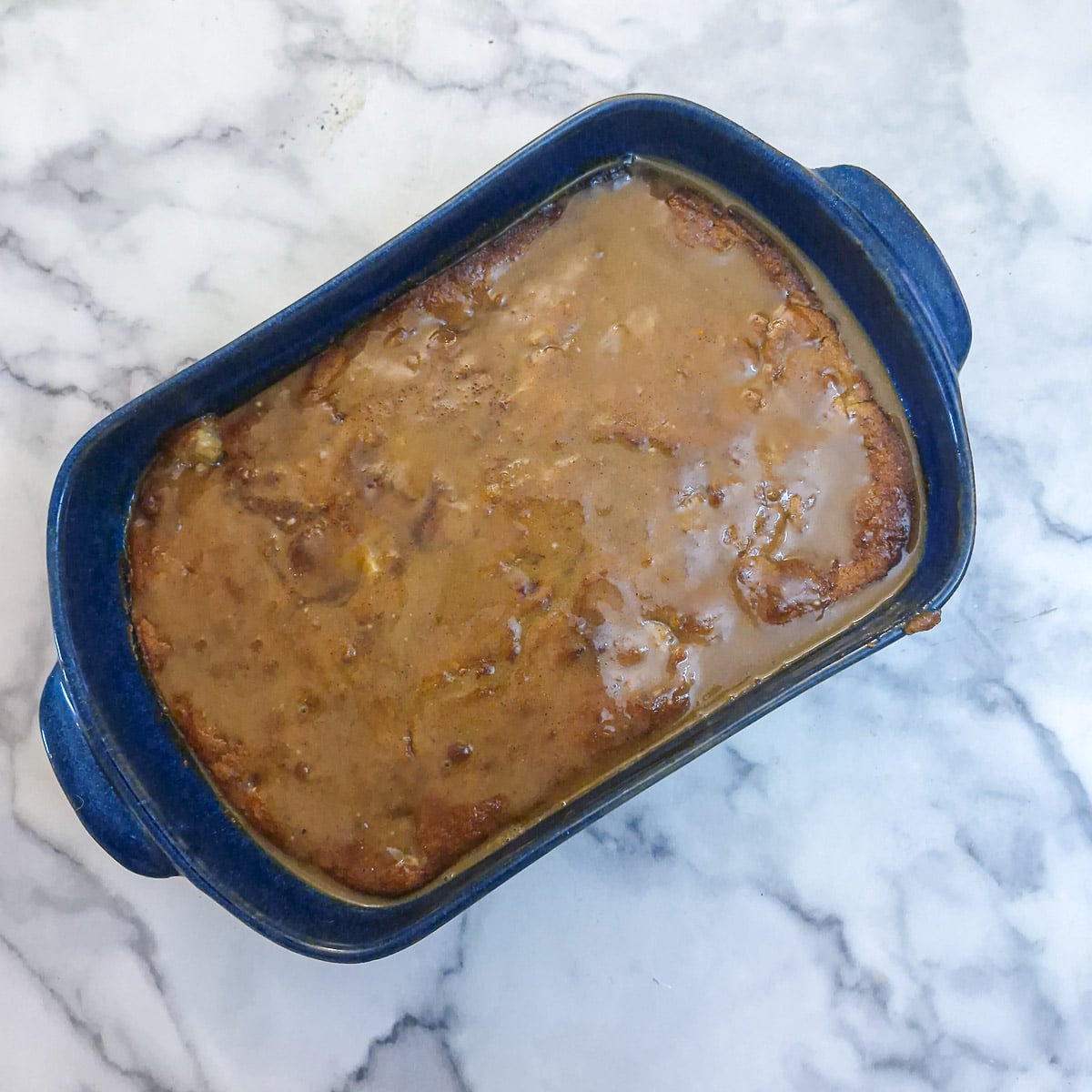 Step 10 - caramel sauce soaking into the apple cake.