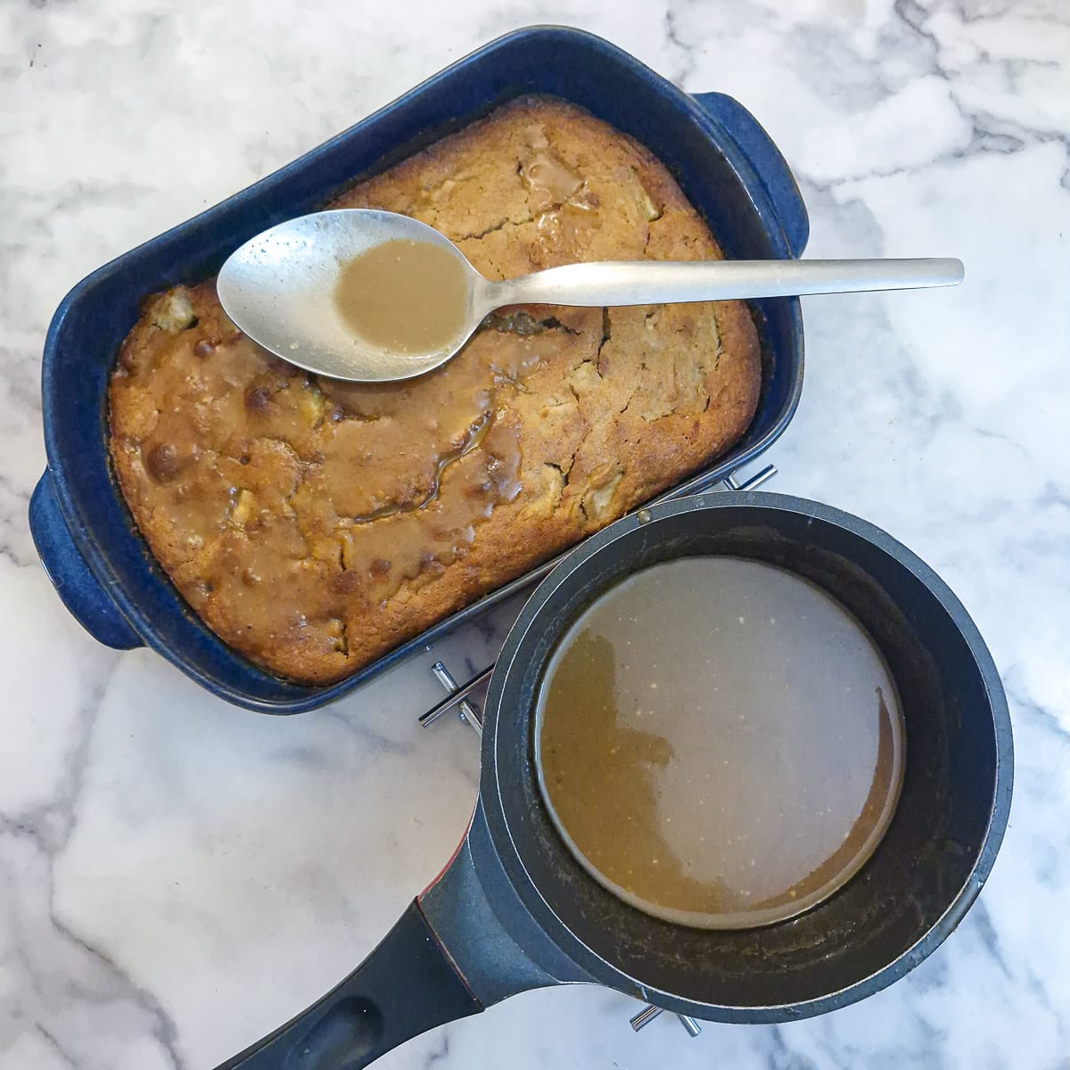 Step0 9 - hot caramel sauce being spooned over the baked apple cake.