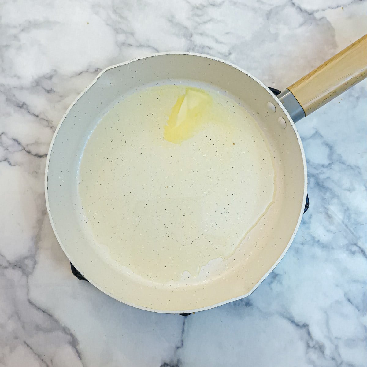 Step 3 - oil and butter warming in a frying pan.