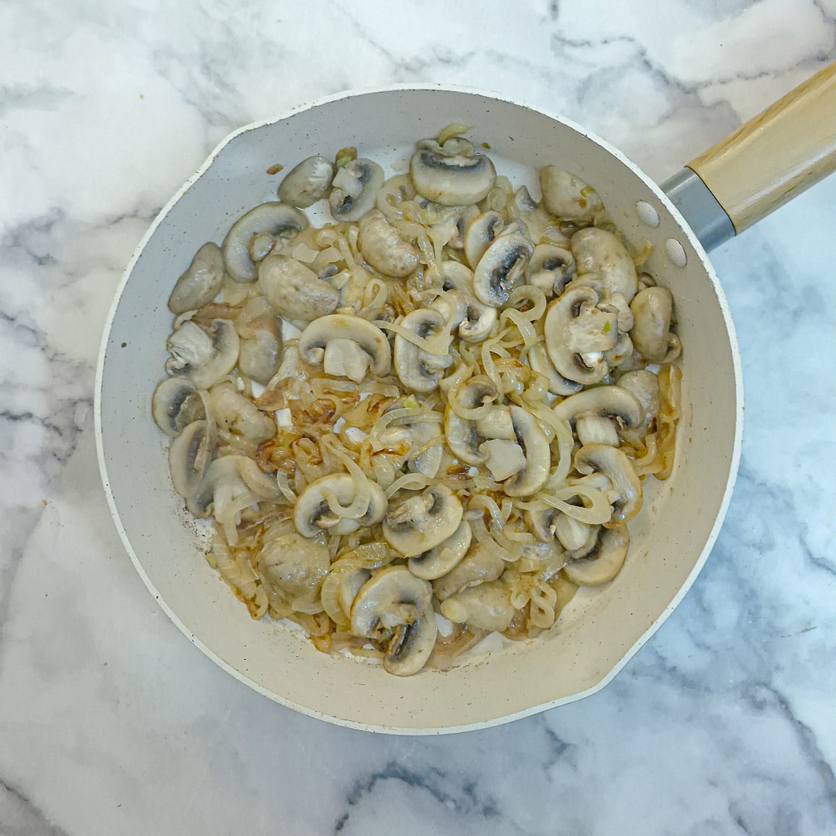 Step 2 - mushrooms frying with the onions.