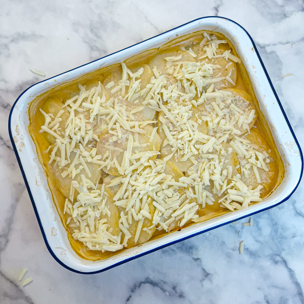 SStep 8 - grated cheese sprinkled on top of the potatoes.