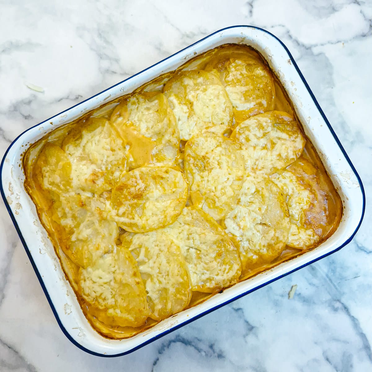 Step 9 - the finished potato bake covered in melted cheese.