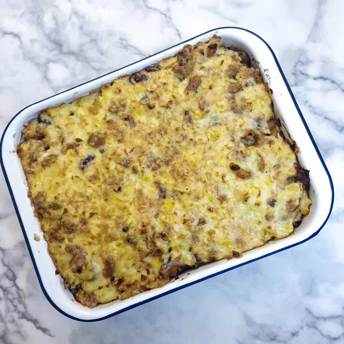 Chilli con carne pasta bake with a beautiful golden topping, ready for the table.