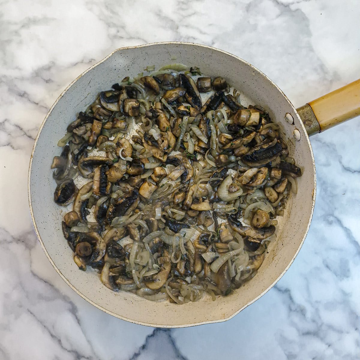 Mushrooms added to the onions.