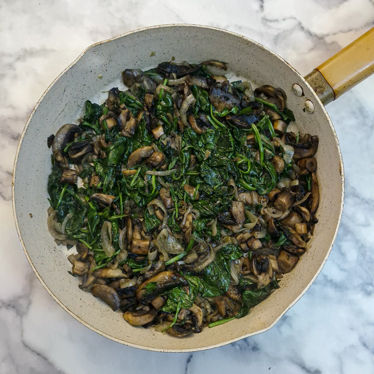 The spinach in the filling, after it has wilted and been left to cool.