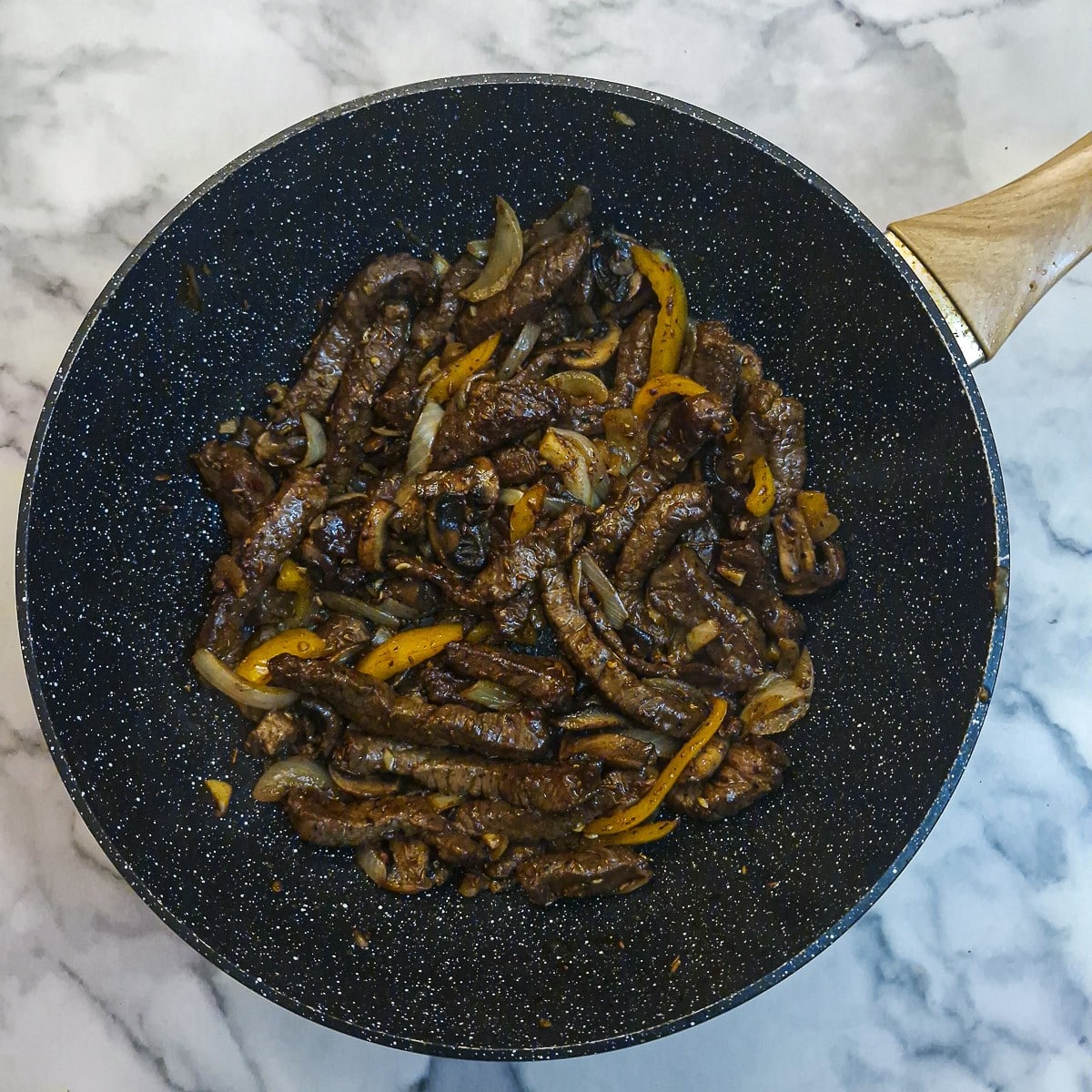 Steak and mushrooms added back to the pan.