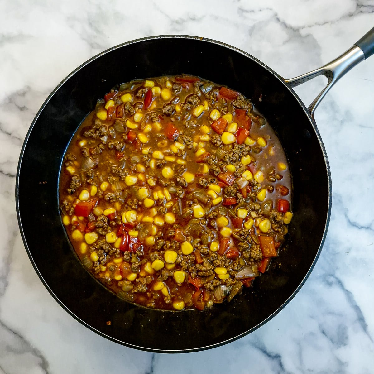 Stock and corn added to the quesadilla filling.
