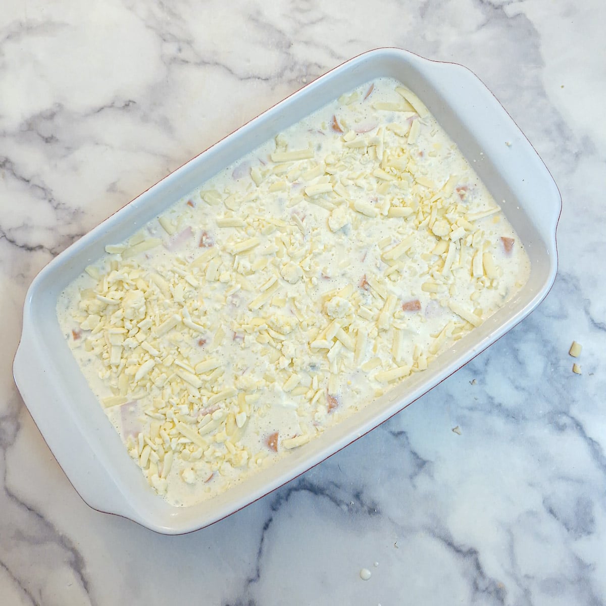 The savoury tart mixture poured into a baking dish - ready for the oven.