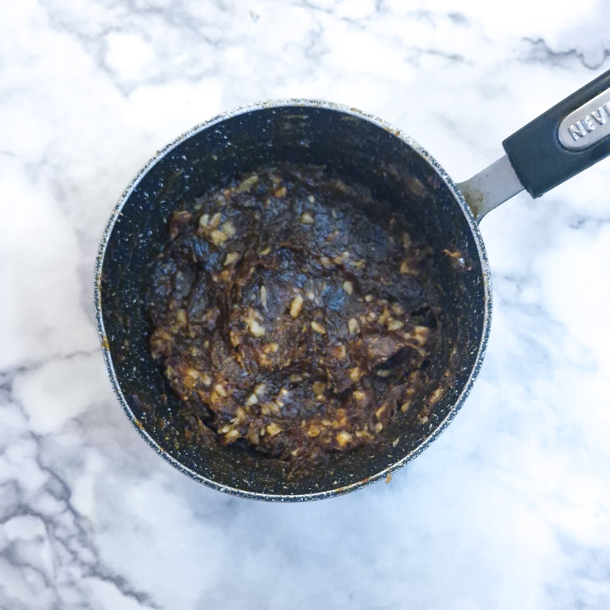 Chopped walnuts mixed into the date paste.