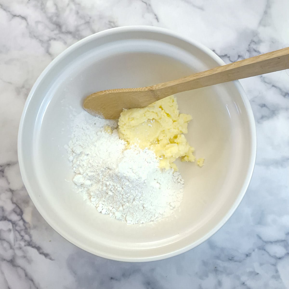 The creamed mixture turned out into a mixing bowl and flour added.