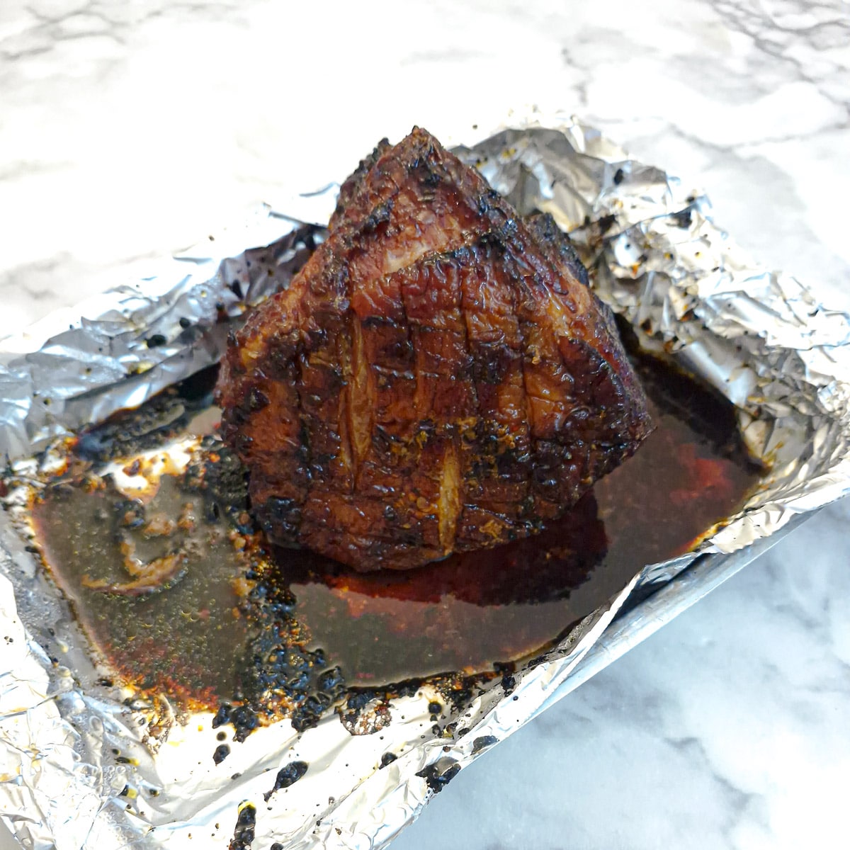Fully cooked gammon after it has been glazed and cooked for a further 20 minutes.