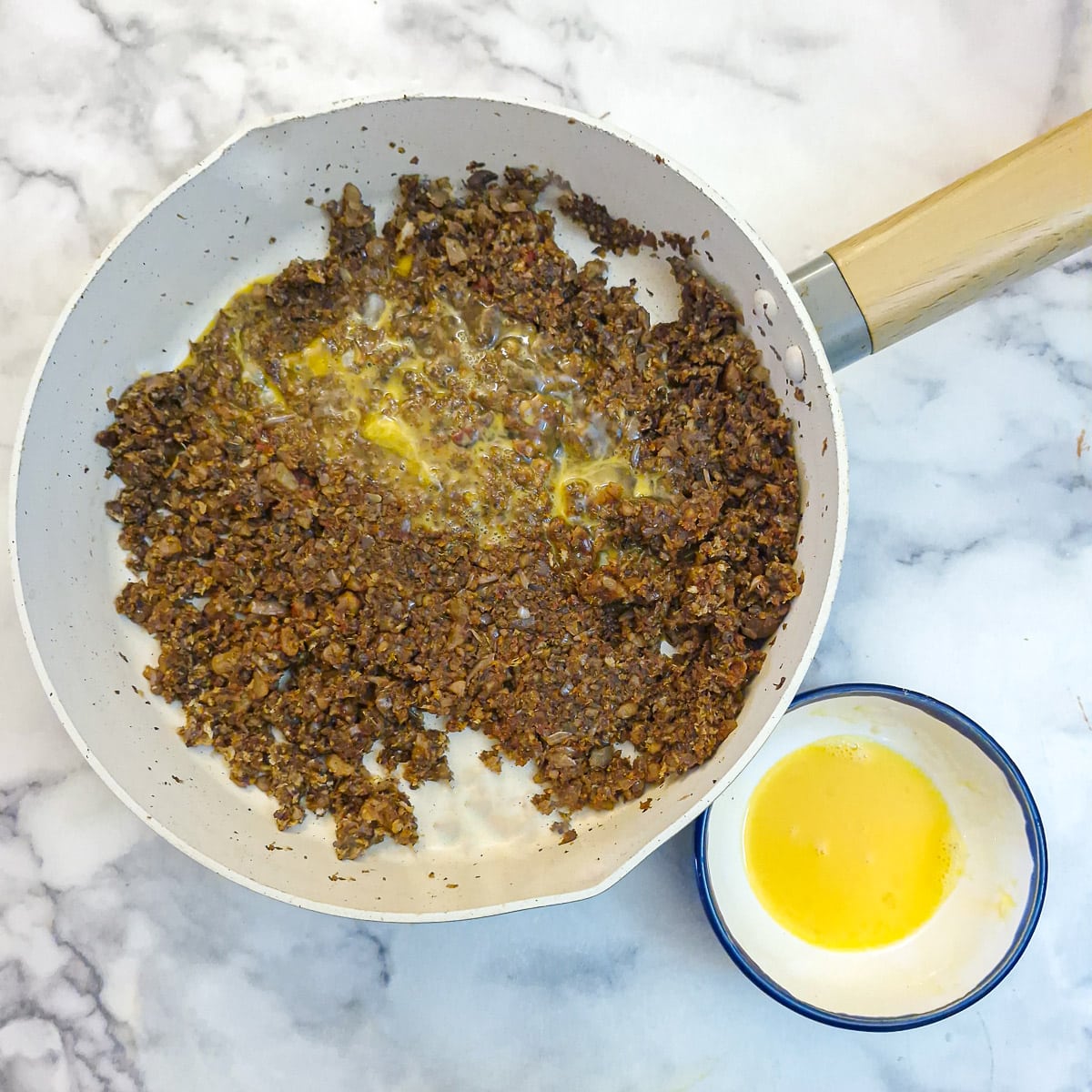 Three-quarters of a large beaten egg added to the mushroom filling.