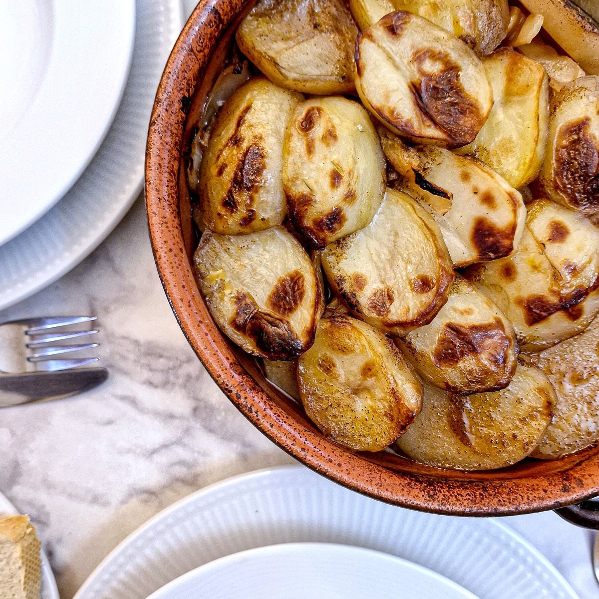 Close up of the browned potato topping on the oven-baked lamb potjie.