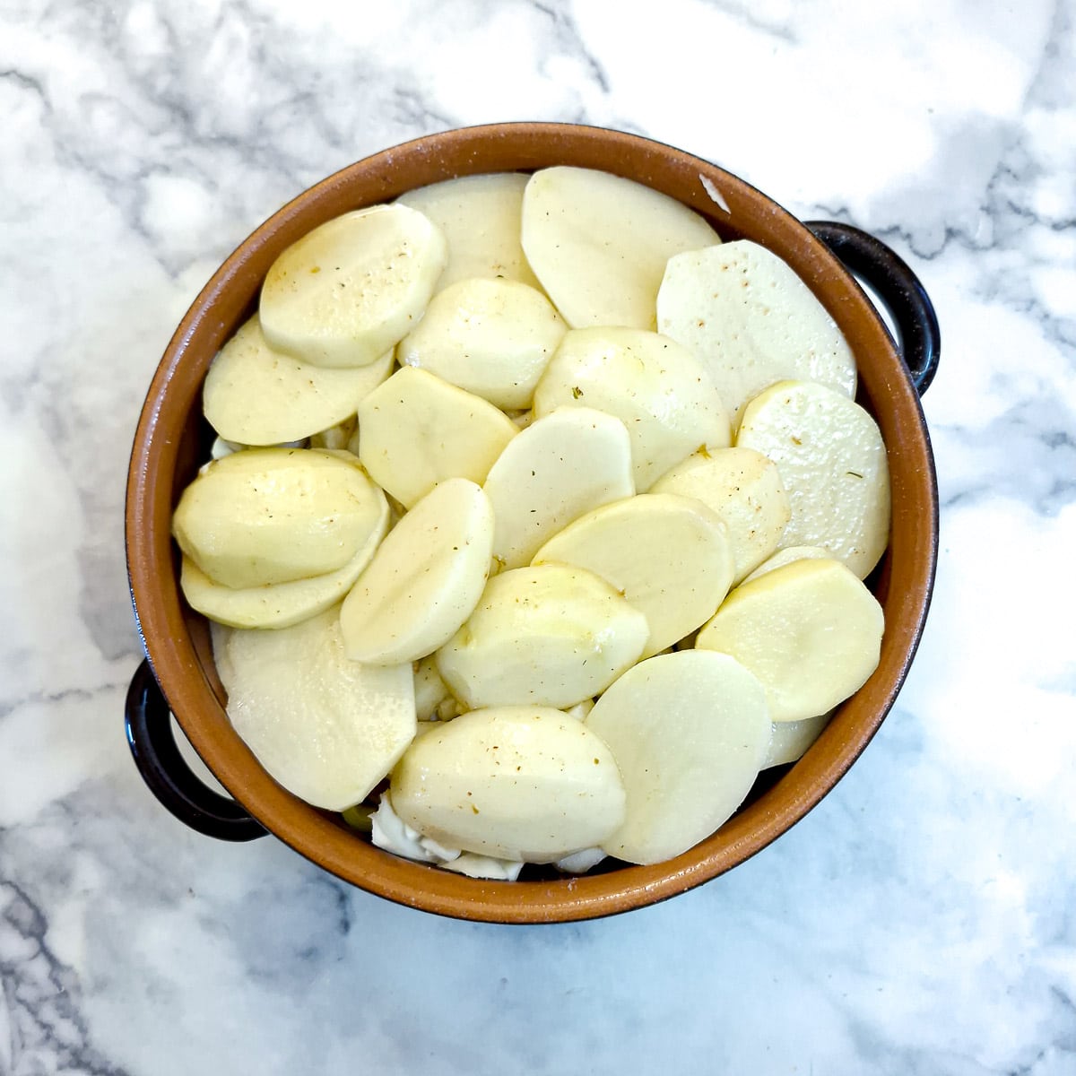It's difficult to notice, but this is showing the lamb potjie in a casserole dish, with stock coming half-way up.
