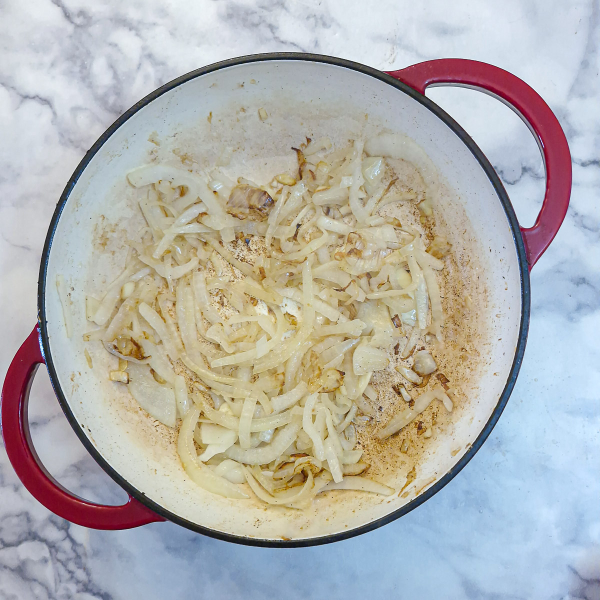 Step 2 - soften the sliced onions and garlic in the same pan.