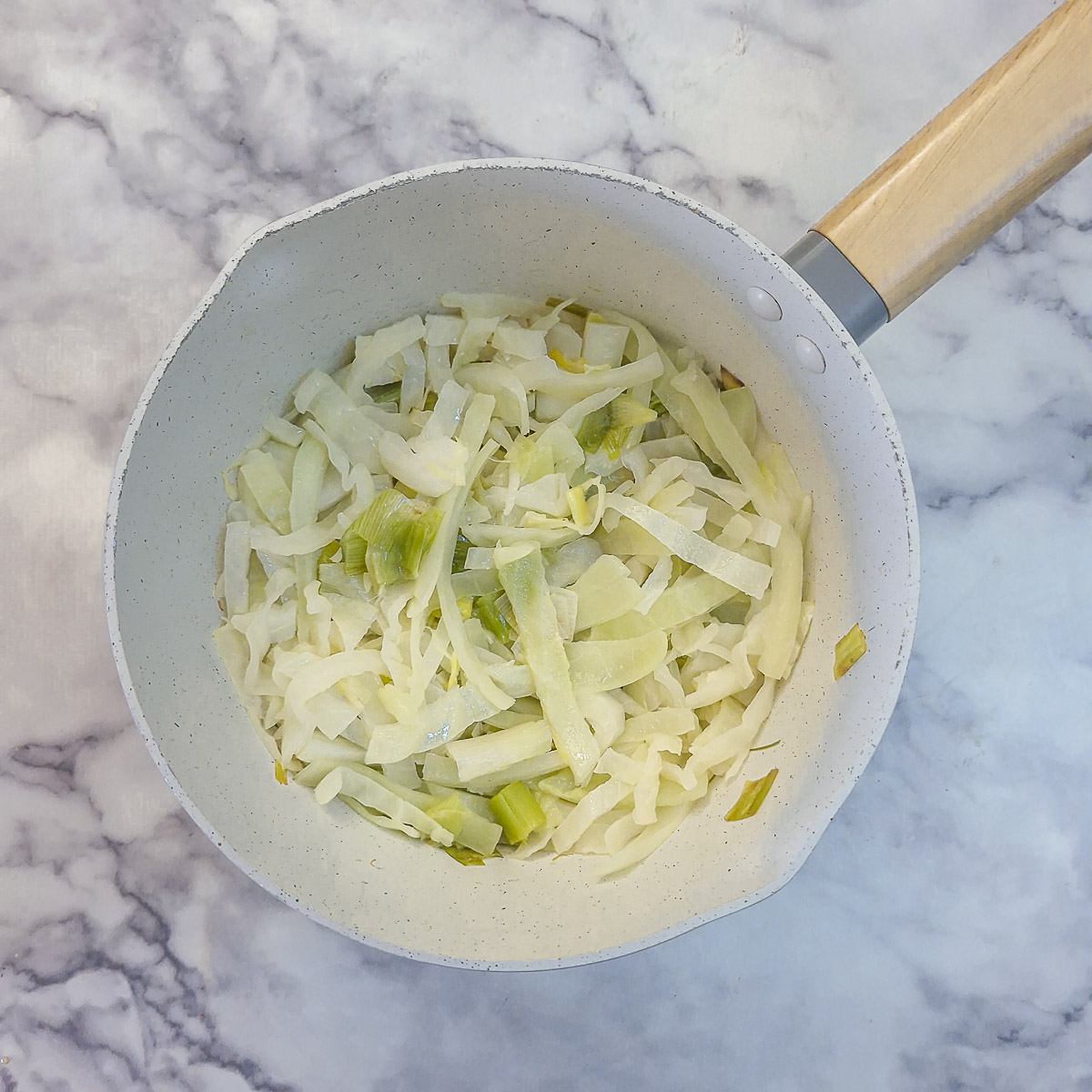 Step 3 - chopped cabbage added to the leeks and allowed to soften.