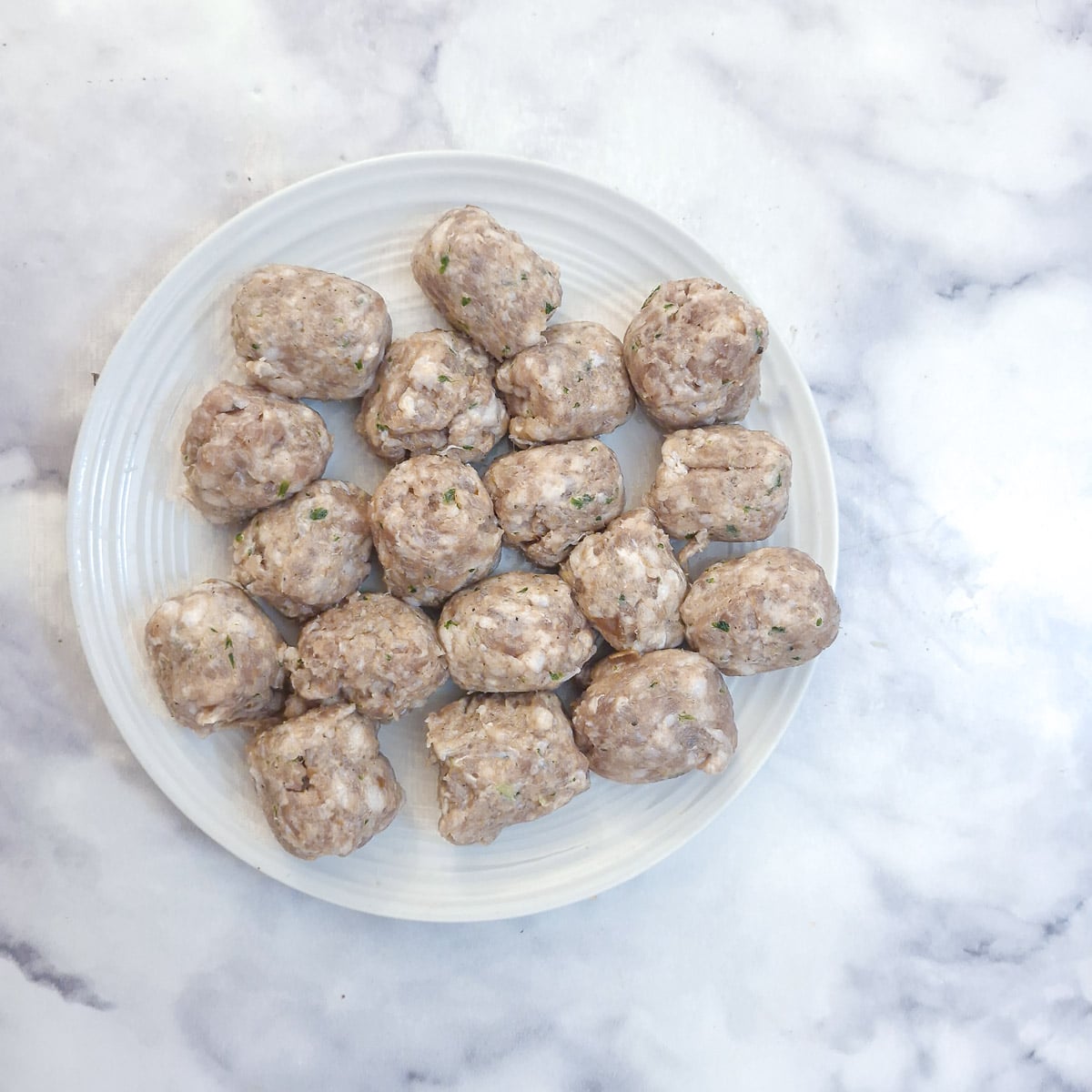 Step 5 - sausage meat removed from the sausage casing and formed into balls.