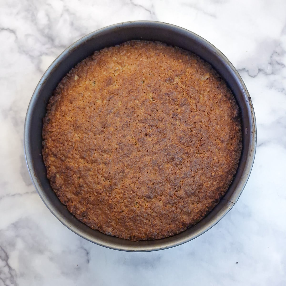 A baked lemon, walnut and biscuit cake.