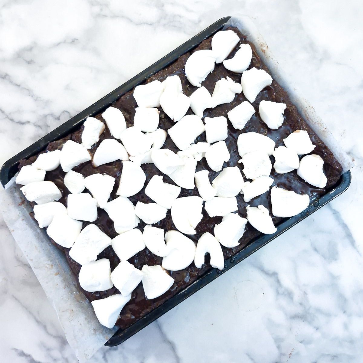 Marshmallows arranged on top of the jam.