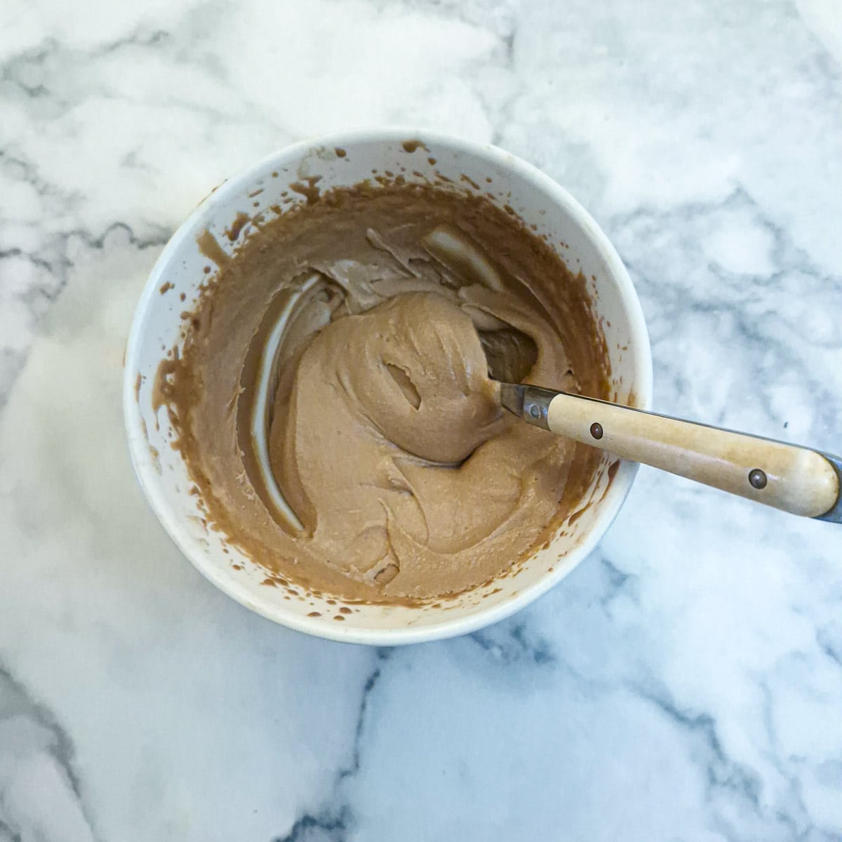 Cooled chocolate ganache beated with a hand mixer until thick.