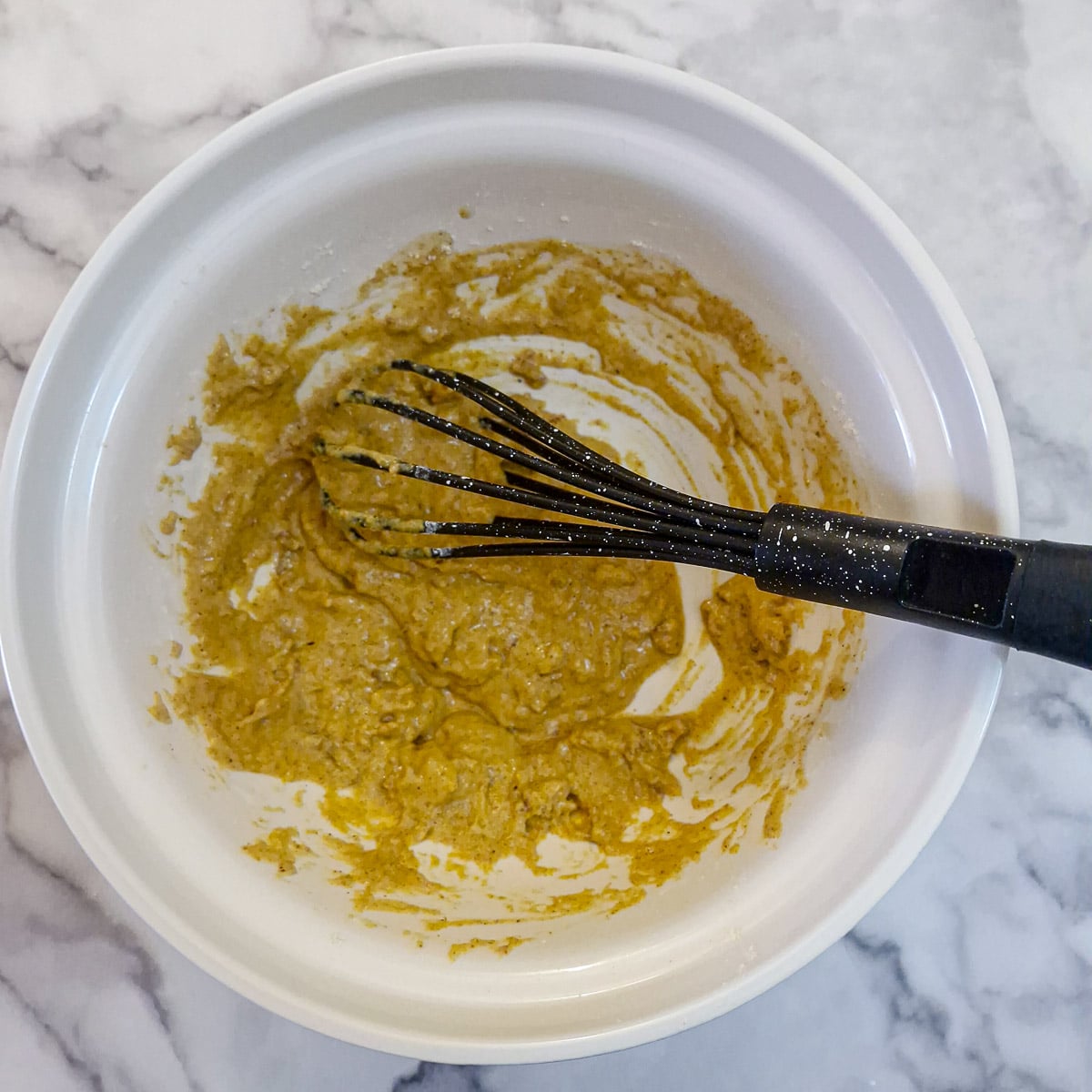 Step 2. Most of the water mixed into the batter. The consistency is very thick and sticky.