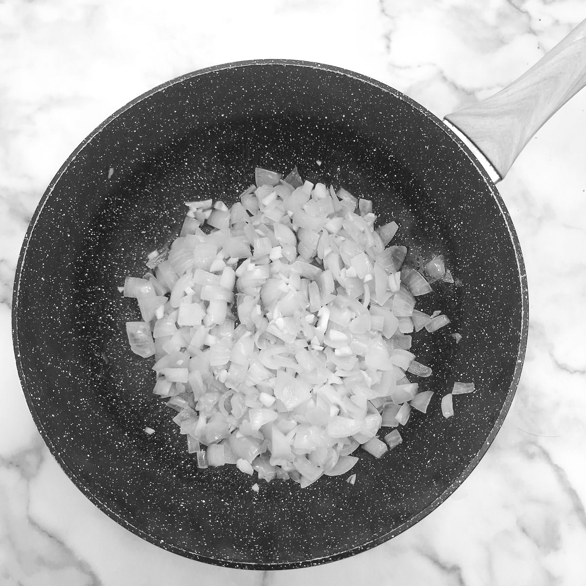 Step 4 - onions softening in a wok.