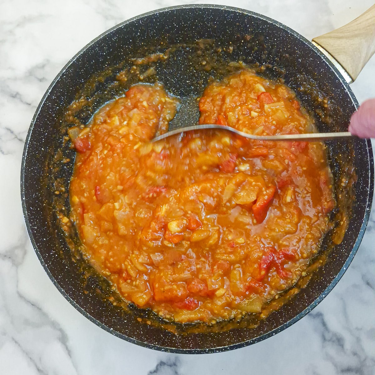 Step 9 - the tomato cooking sauce in a wok before being blended.