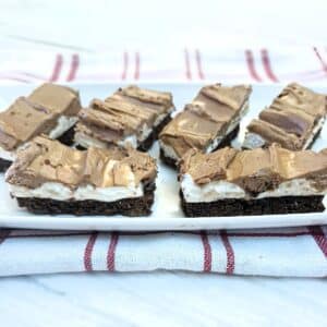 Slices of homemade wagon wheel traybake on a white plate.