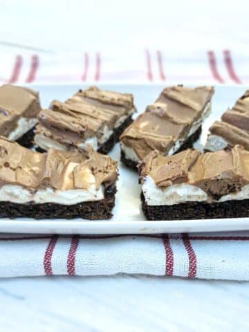 Slices of homemade wagon wheel traybake on a white plate.
