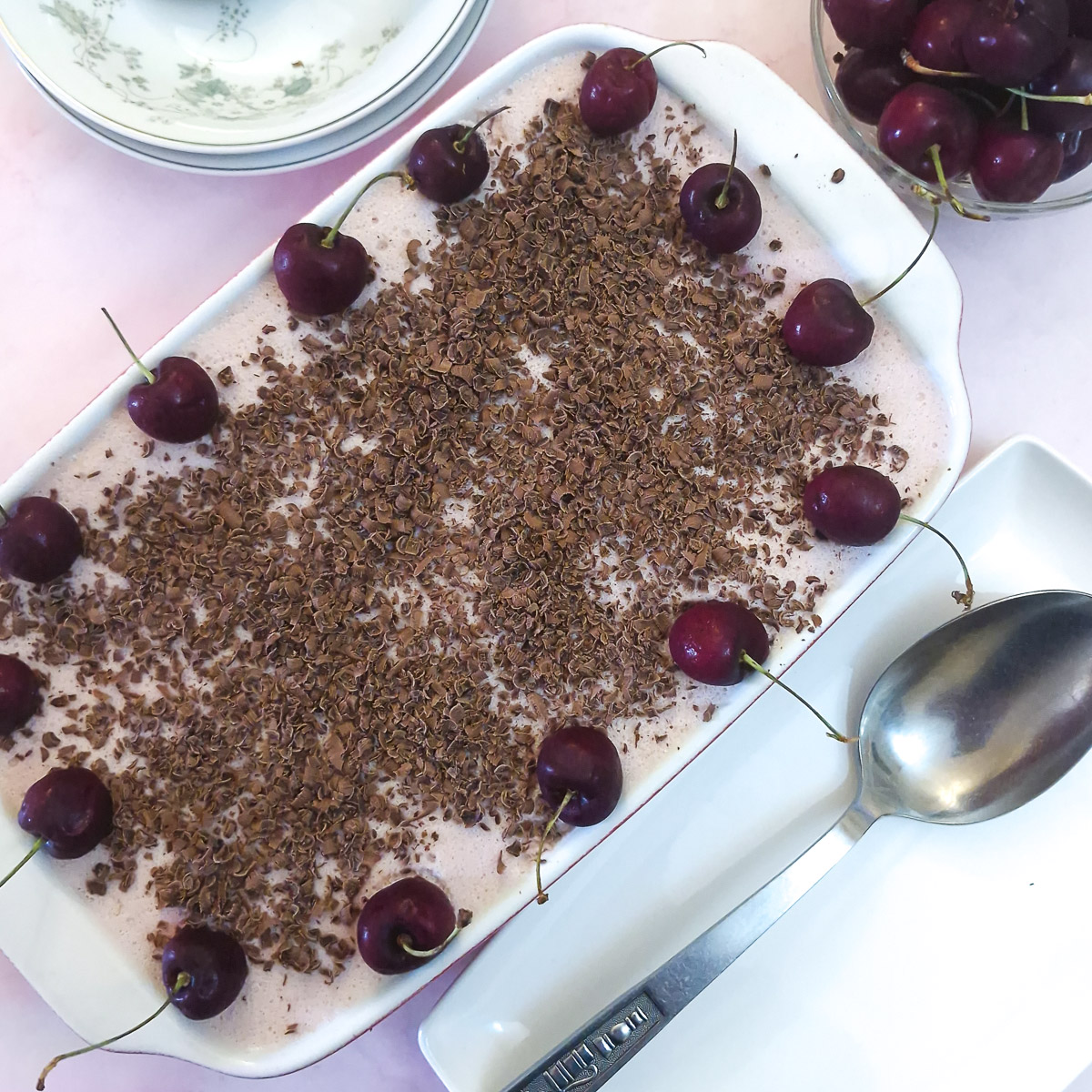Step 9 - the finished dish, garnished with grated chocolate and fresh cherries.