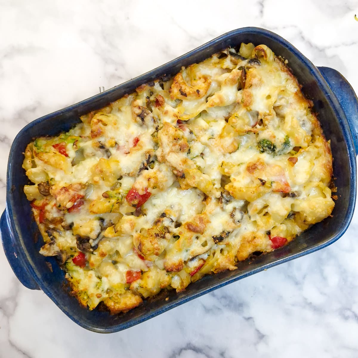 Step 11 - a baked dish of chicken and vegetable pasta bake.