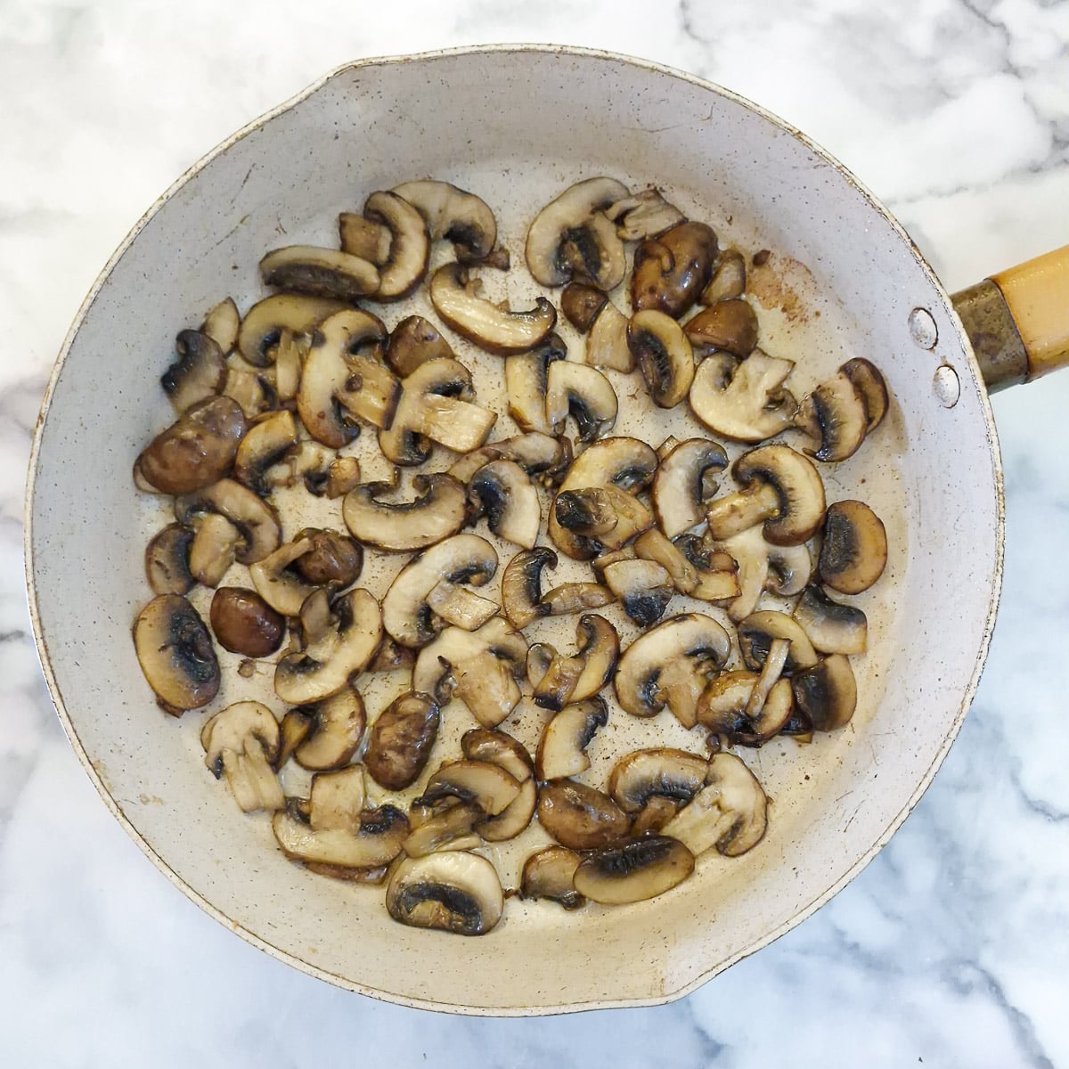 Step 4 - the mushrooms being softened in the frying pan.