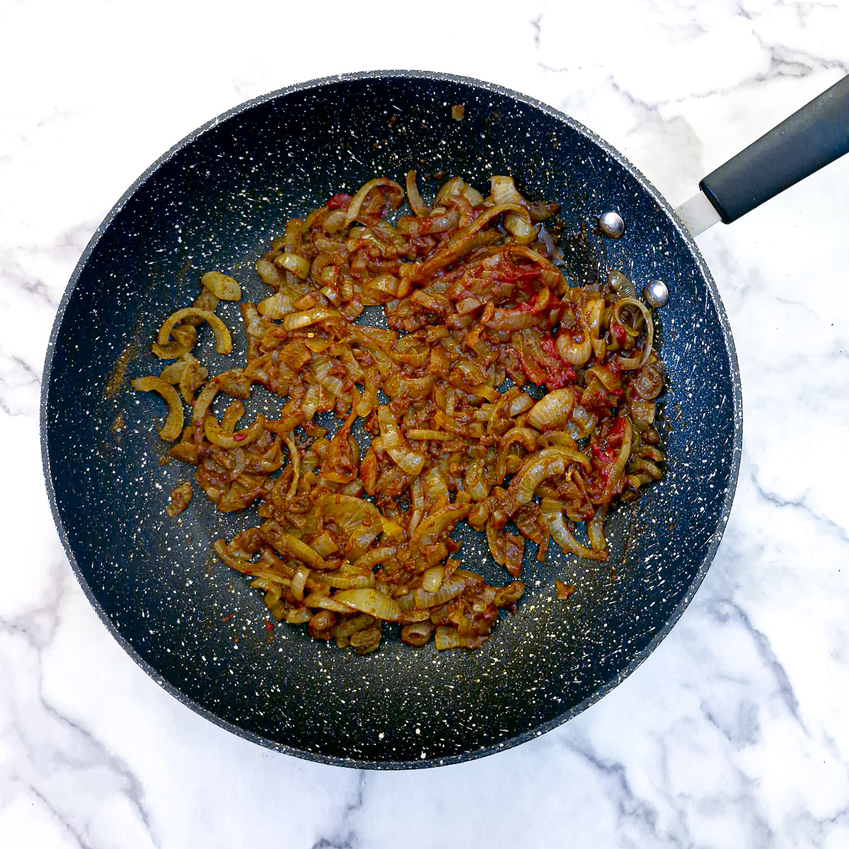 Step 4 - Worcestershire sauce and tomato puree stirred into the onions.
