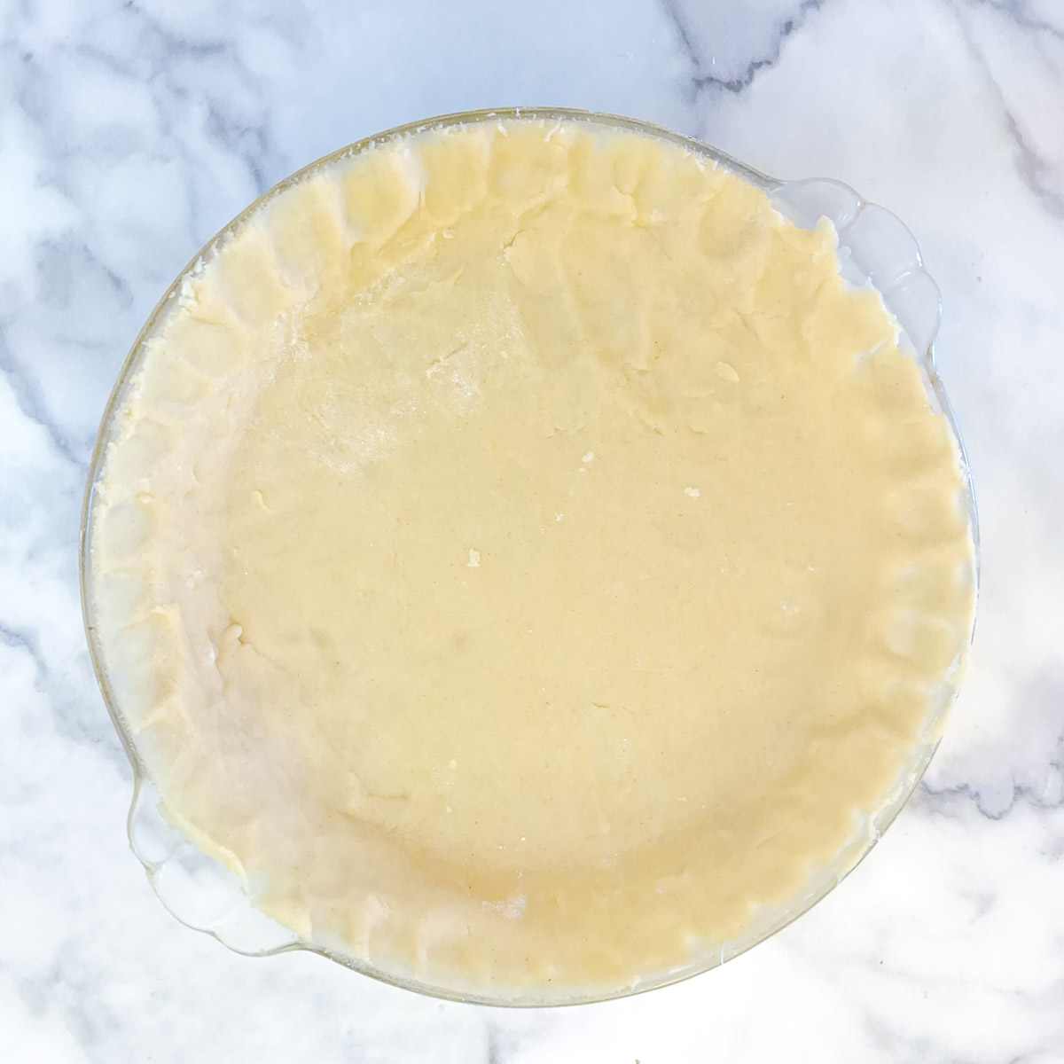 Step 12 - pastry lined and trimmed in a pie dish.