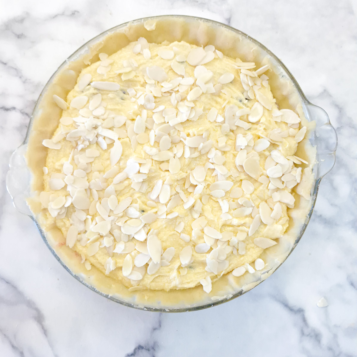 Step 17 - flaked almonds sprinkled over the frangipane.
