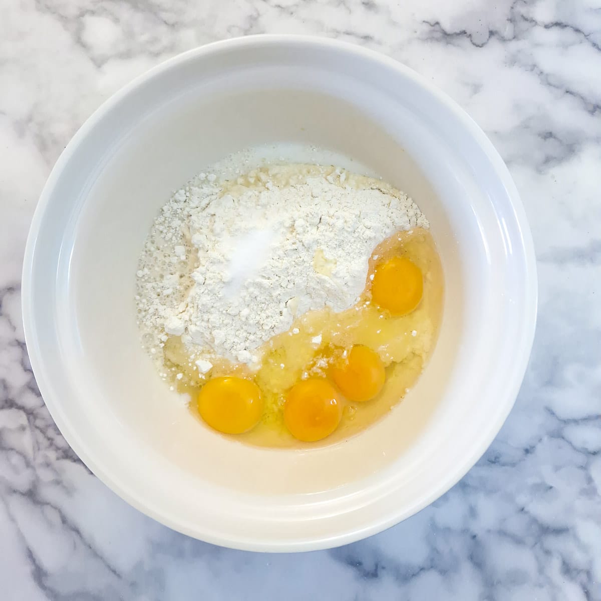 Step 1 - flour eggs and liquid in a mixing bowl.
