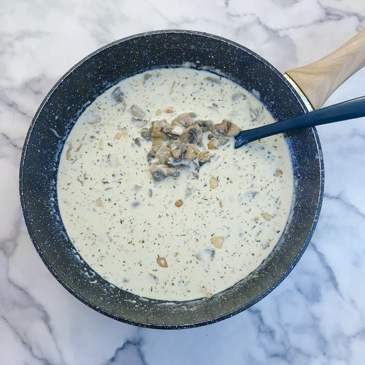 Step 5 - milk and cream has been added and is being brought to a boil.